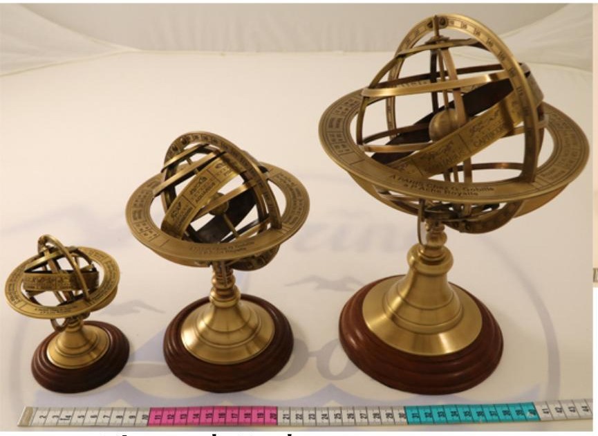 Three brass armillary spheres on wooden bases