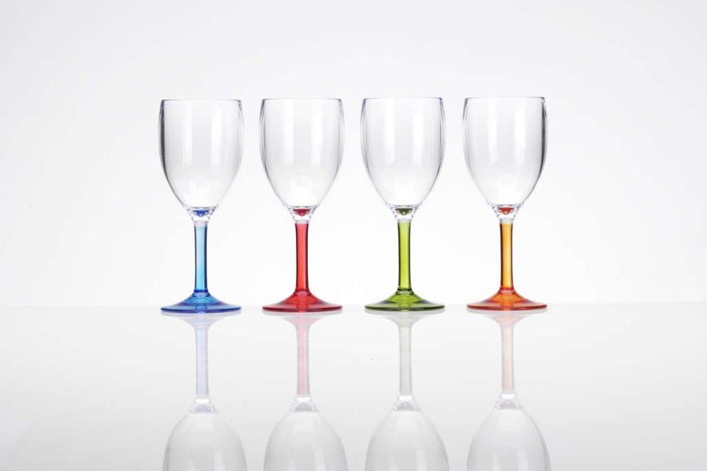 Four clear glasses with blue, red, green and orange stems