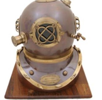 Decorative brass and copper diver's helmet on a wooden base